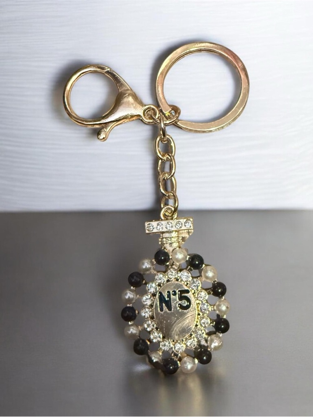 Gold-Tone N5 Beaded Pendant Keychain in Gold, Black, Pearl
